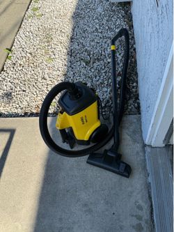 Eureka Mighty Mite canister vacuum cleaner in yellow.