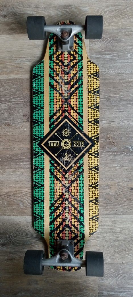Tawa 2015 skateboard, green, orange, and yellow