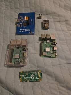 2 Raspberry Pi 3's, a raspberry Pi Zero W, an esp8266, and a 400×800 touch screen module