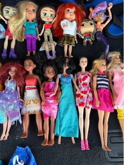 Five Barbie dolls all dressed up for only $20.00
