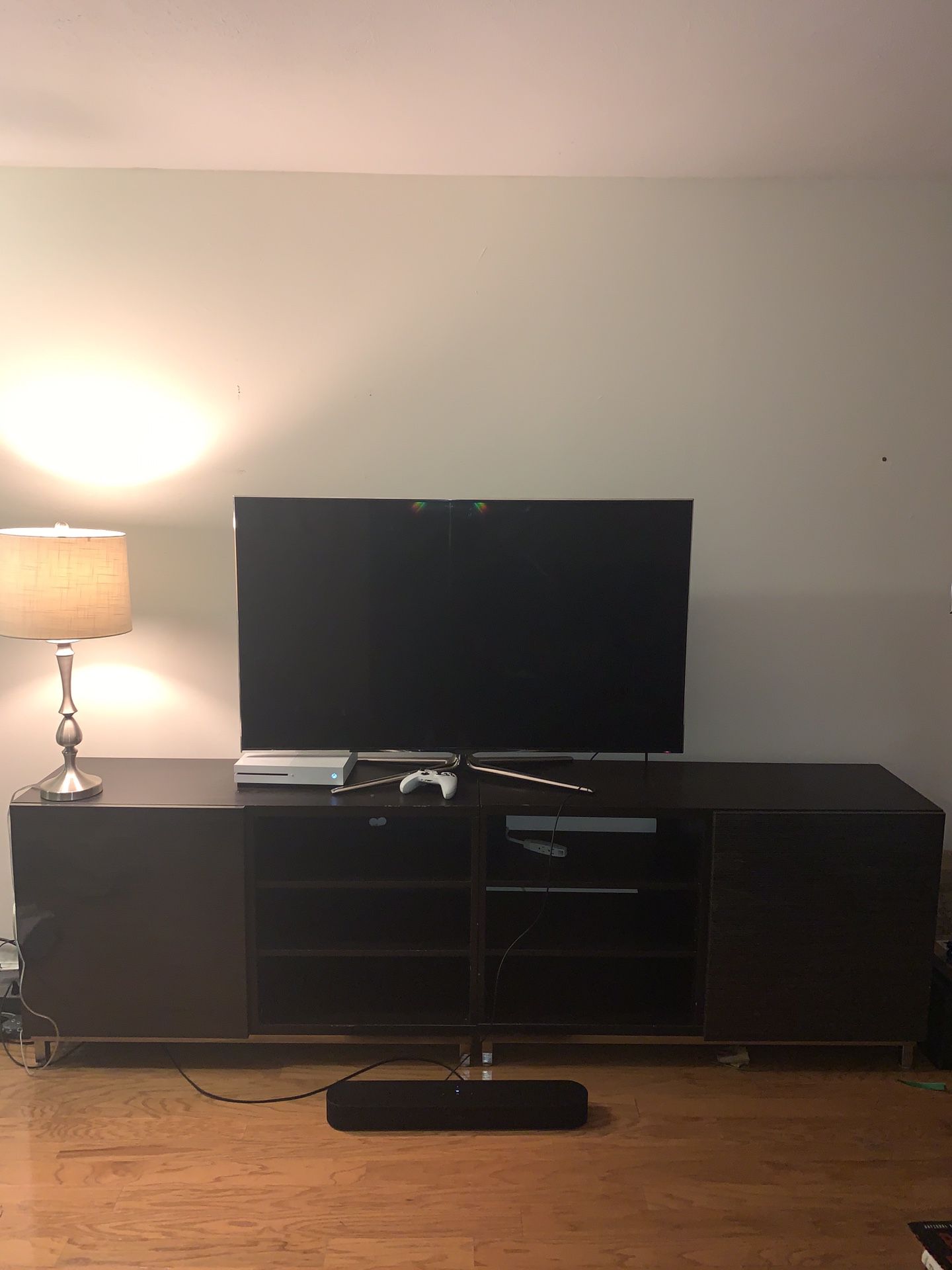 Symmetrical Entertainment center with storage doors and shelves