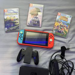 Nintendo Switch with case, 3 games, and dock