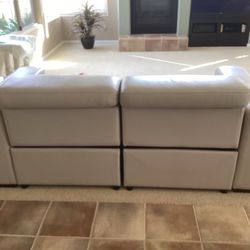 Two Adjustable leather Recliners with optional middle seat