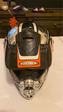 Dirt bike helmet with carrying bag