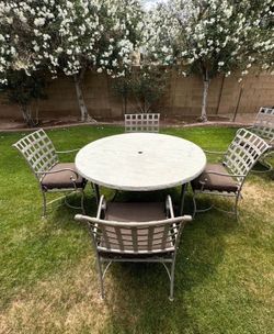 Patio Set. OW Lee. Table and Four Chairs. All iron. Nice Condition.