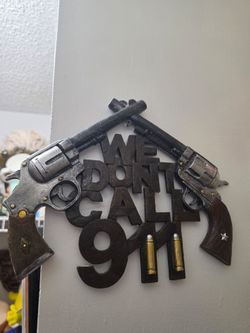 11.5"W Wild West We Dont Call 911 Dual Six Shooter Guns With Bullets Wall Decor