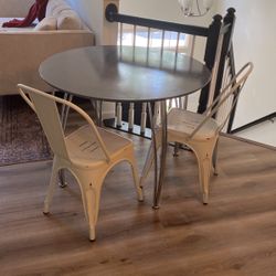 Table With Four Metal Chairs 