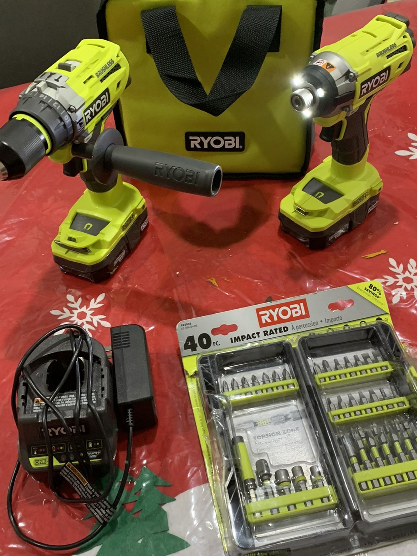 Brand new Ryobi 18v brushless hammer drill and impact with 2 batteries with charger, drill bits