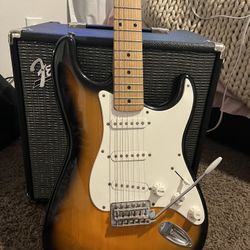 Squier Strat electric guitar, & Rumble 40 fender amplifier