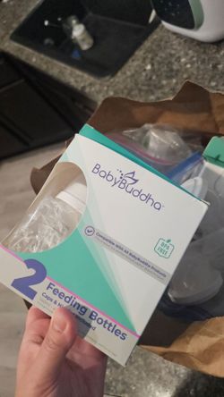 Free Baby Buddha breast pump and parts and milk bags and many breastfeeding parts