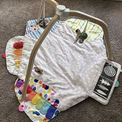 Lovevery baby activity gym and playmat