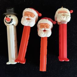 Four Pez Dispensers / 3 Santa’s & 1-Snowman