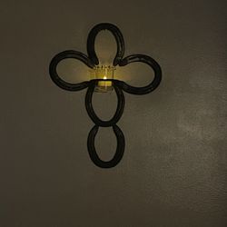 Cross made by horse shoes