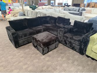 Black L shaped sectional w/ console and ottoman
