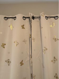 White blackout curtains with gold butterfly’s and flowers