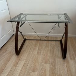 GLASS-TOP DESK. $150 