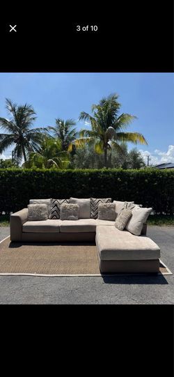 Novelia Beige Rooms To Go Sectional Sofa (Delivery Available)