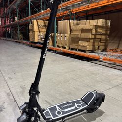 Electric scooter with shock absorption