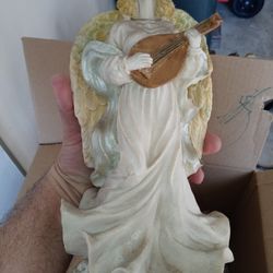 Porcelain. Statue Of Angel Playing A Instrument