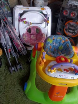 Two baby walker and two stroller and a car seat $50 for all
