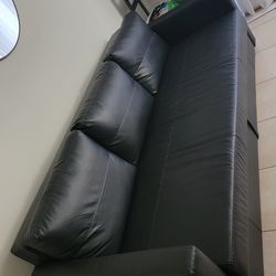 Black leather sofa bed