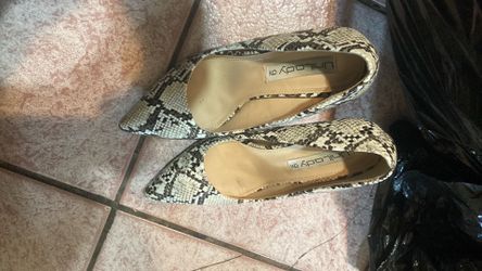 Woman’s high heel shoes, size 9