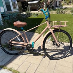 Beautiful custom women’s bike with a front basket.