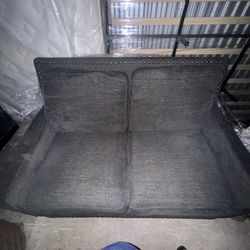 Black Leather Couch and Blue Love Seat