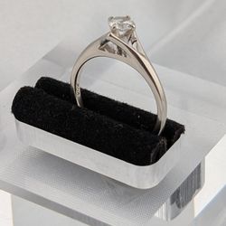 14 KARAT WHITE GOLD SOLITAIRE ENGAGEMENT RING W/ 1/4 CARAT SIMULANT  DIAMOND 
SIZE 5.5