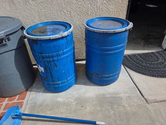 2 plastic storage barrels