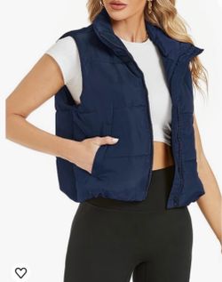 Navy blue puffy Vest full zipper size small.   (S)