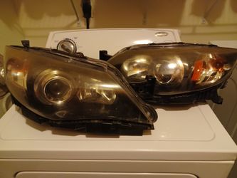 2010-2011 Subaru Impreza Headlamps. (OEM) Bulbs Still Included