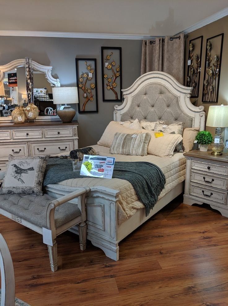 Realyn Chipped White Upholstered Panel Bedroom Set