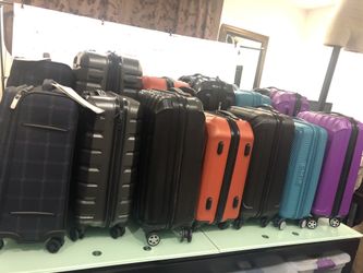 Large selection of assorted brand new suitcases All New