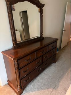 dresser and mirror set or a bedroom dresser.