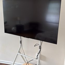 Perfect Condition Slightly Used 65” TV With Stand On Wheels 