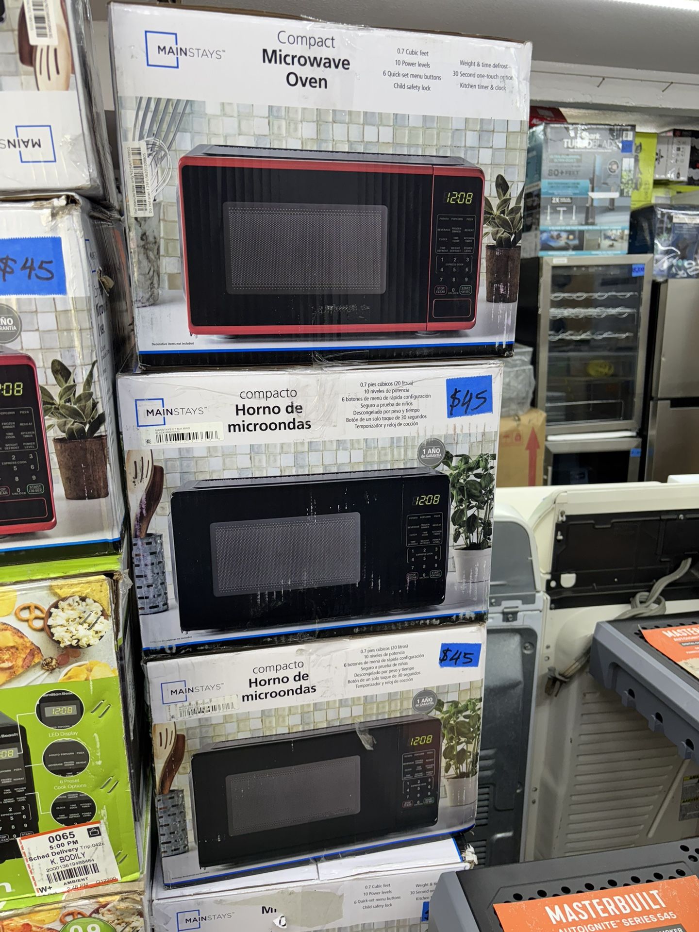 Mainstays 0.7 Cu ft Countertop Microwave Oven Black Red and White, 700 Watts, microondas