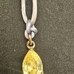 Yellow Teardrop Rinestone Pendant On Lilac Fabric Cord 
