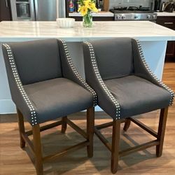 TWO beautiful bar gray upholstered counter stools with nailhead trim and armrests