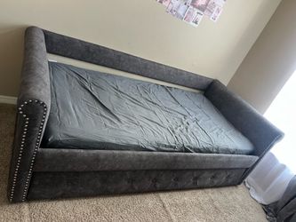 Twin size upholstered, daybed sofa with rollout trundle