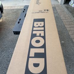 Closet doors-Masonite bifold doors brand new in the box . 2’8” and 2’6” with 4panel design.