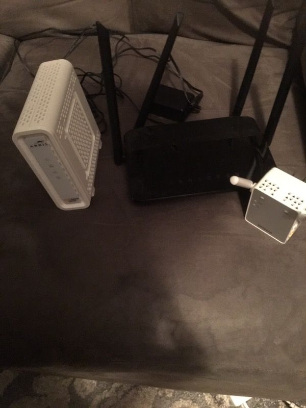 Arris SURFboard Cable Modem, D-Link Wireless Router, and Netgear Range Extender