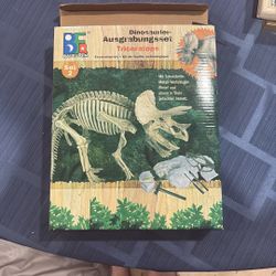 Unopened dinosaur dig and build kit for kids