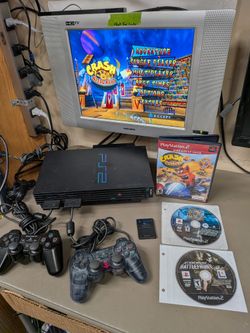 PlayStation 2 PS2 with 2 controllers, 3 games and hdd