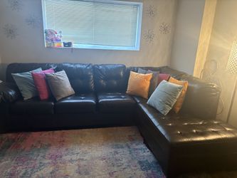 Sectional with pillows and rug included