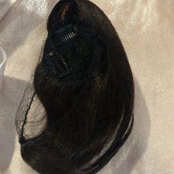 1 Woman Dark Color Hair Part Short  Bangs Longest  Part Is 9 Inch 