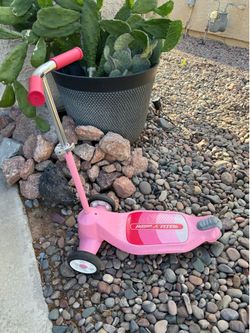 Pink children’s scooter