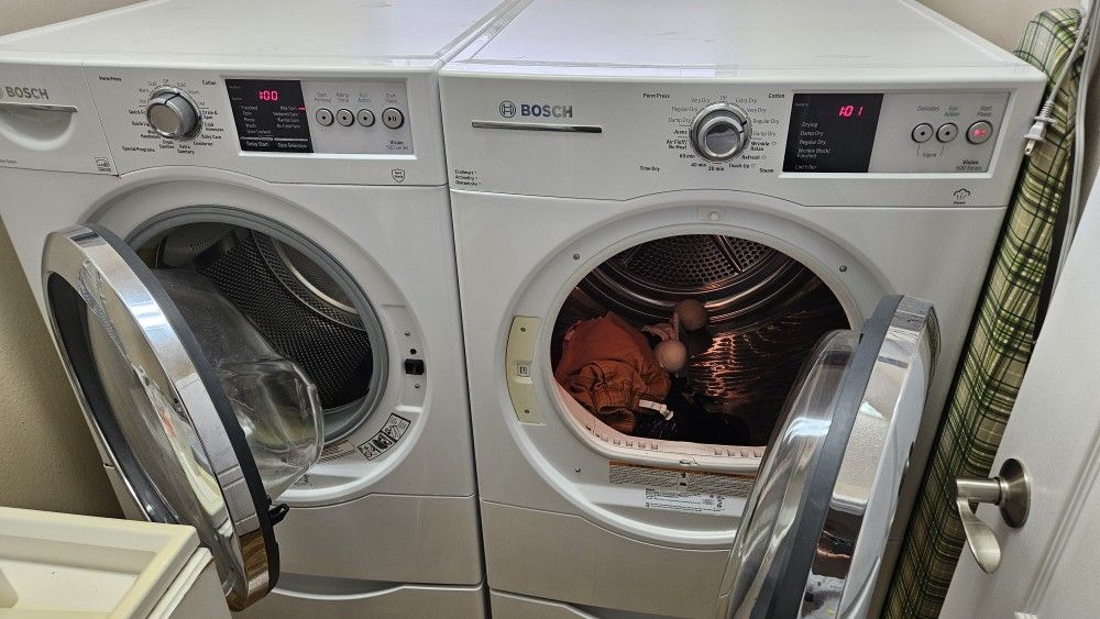 Bosch Washer And Electric Dryer On Pedestals