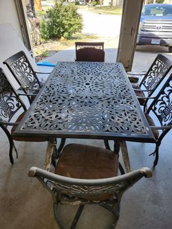Cast Almunium Dinning Table With 4 And Two Swirling Chair 