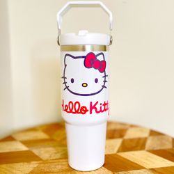 NEW Hello Kitty 30oz Tumbler.Double wall Stainless Cup keeps cold and hot drinks. Flip straw and hand carry handle.   FEATURES: Double-wall vacuum ins